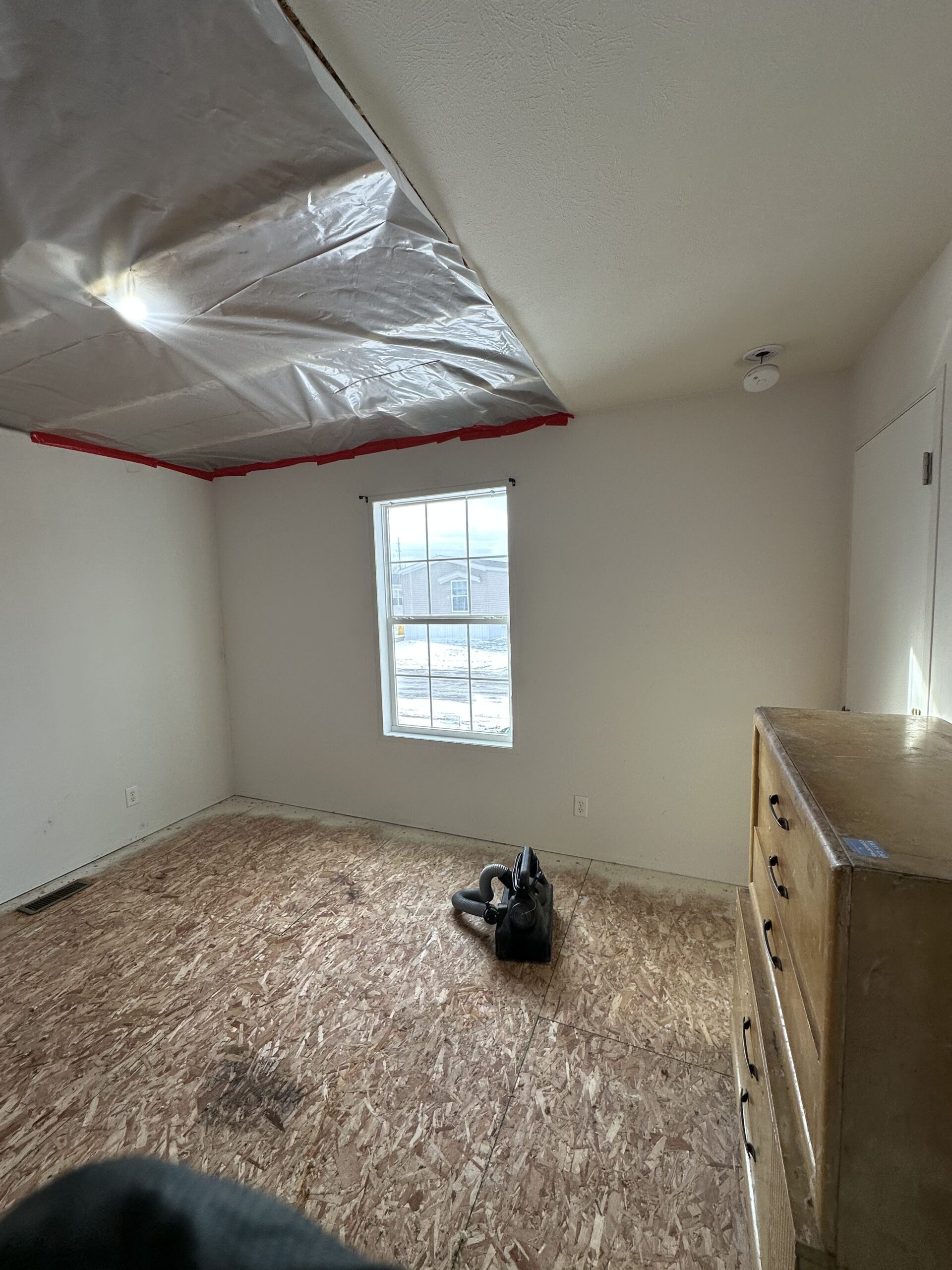 Professional water damage restoration service in Metro Detroit home with wet materials and cleanup needs